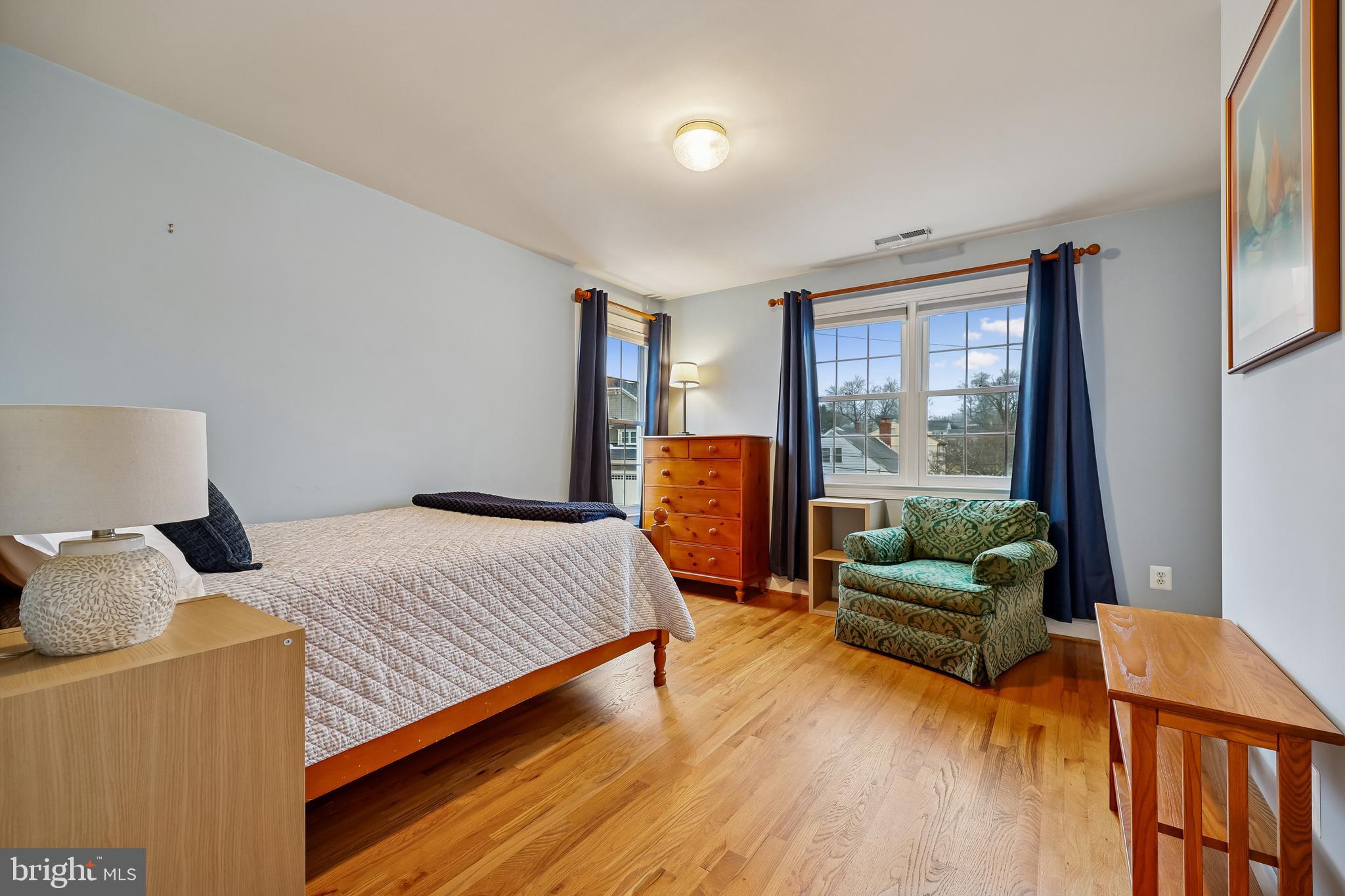 8807 Ridge Road Bethesda, MD 20817 - Photo 30 of 72 a bedroom with a bed and glass window