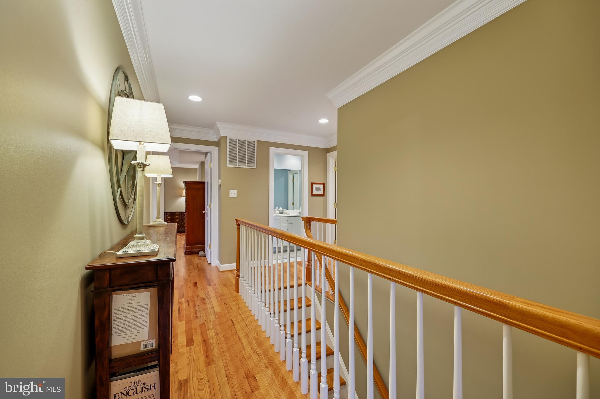 8807 Ridge Road Bethesda, MD 20817 - Photo 36 of 72 a view of a hallway with wooden floor and staircase
