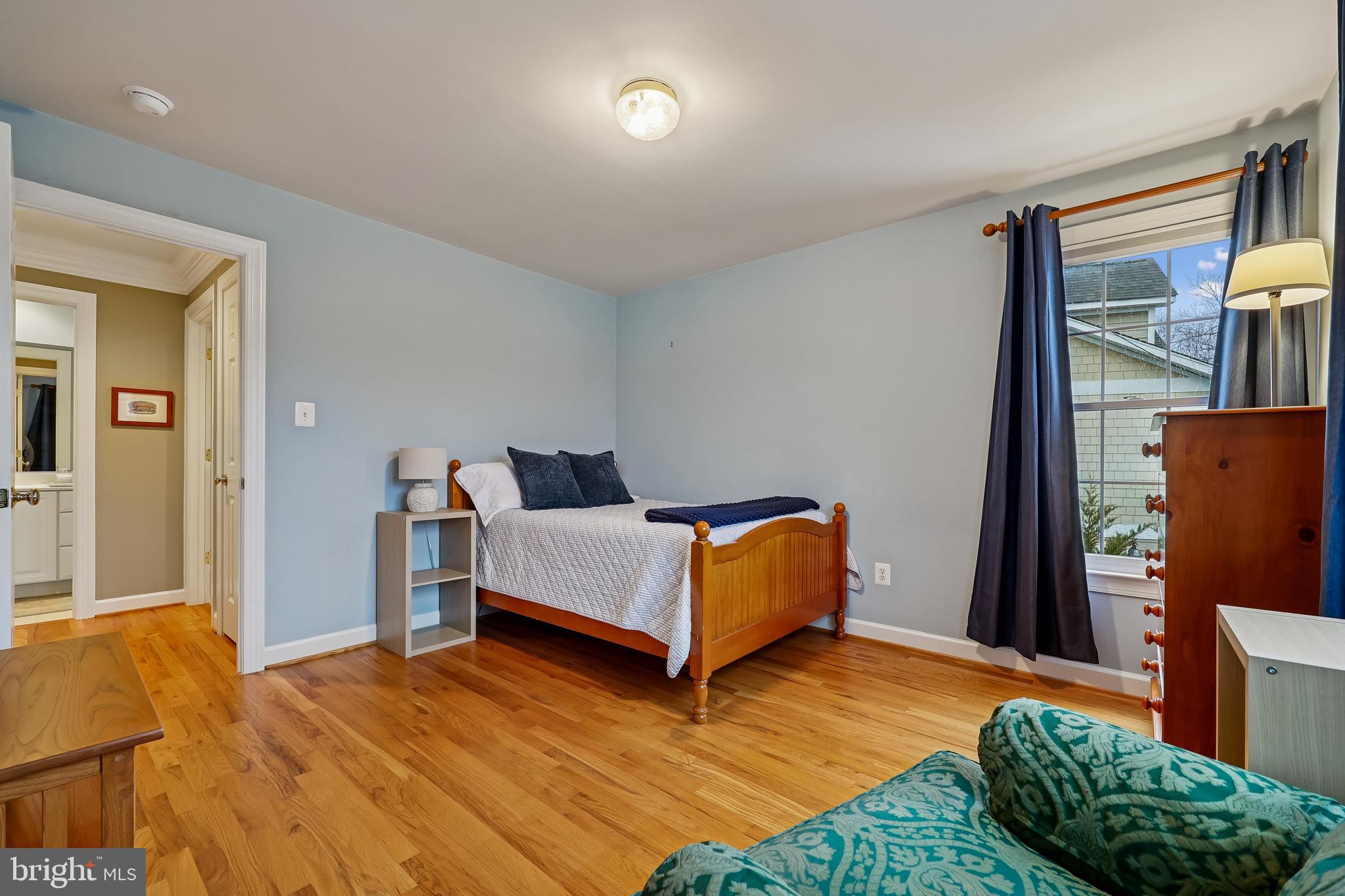 8807 Ridge Road Bethesda, MD 20817 - Photo 45 of 72 a bedroom with a bed and a mirror