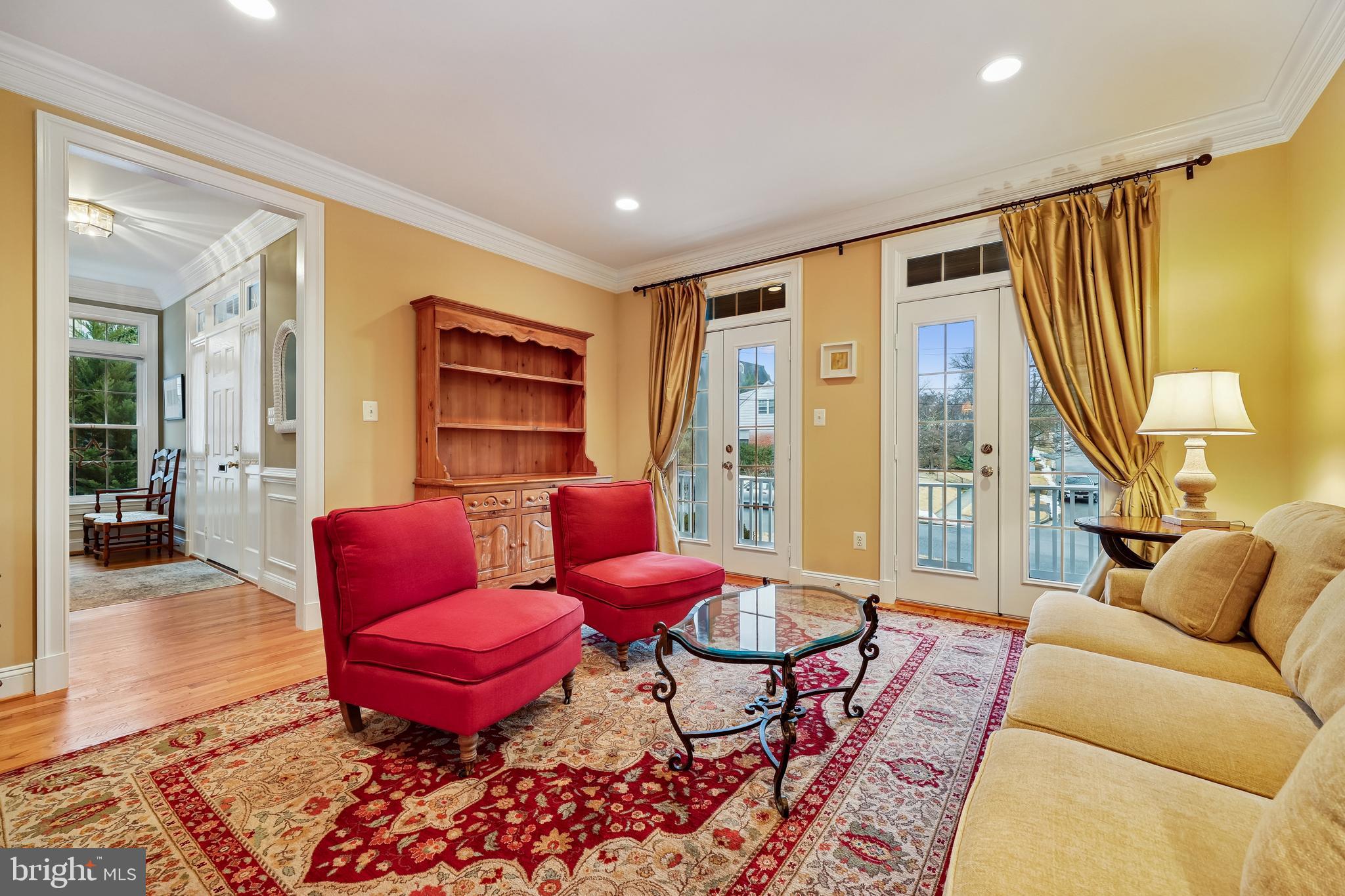 8807 Ridge Road Bethesda, MD 20817 - Photo 49 of 72 a living room with furniture a rug and a large window