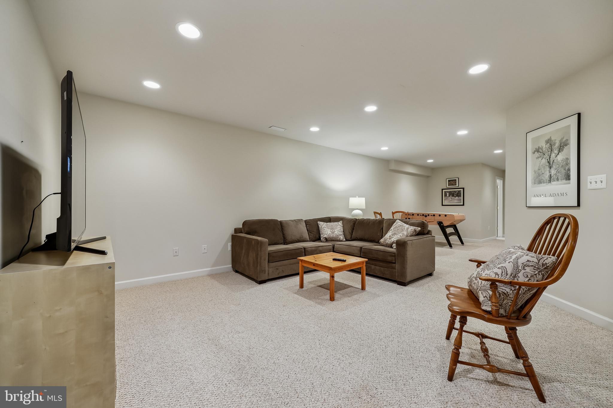 8807 Ridge Road Bethesda, MD 20817 - Photo 59 of 72 a living room with furniture and a flat screen tv