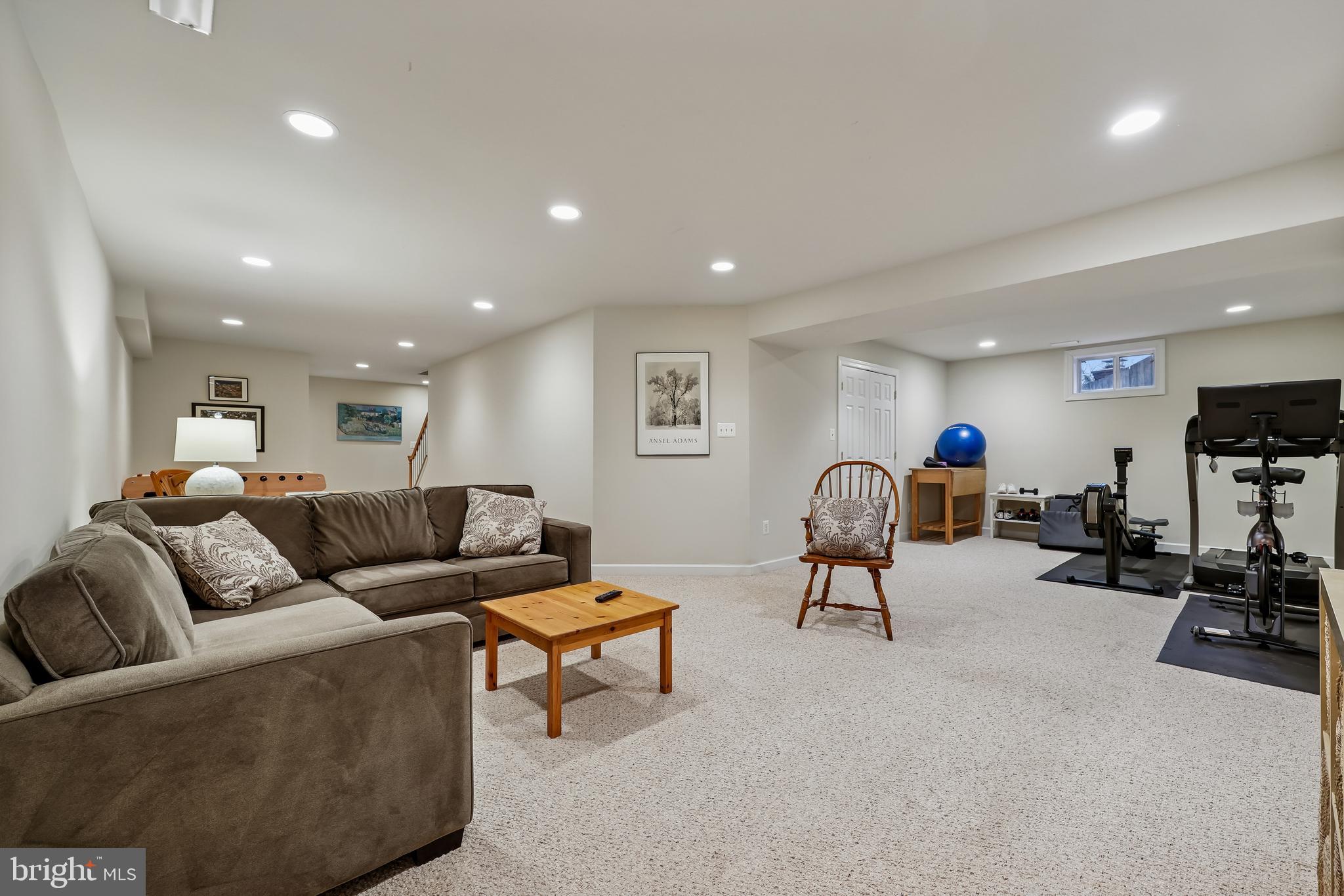 8807 Ridge Road Bethesda, MD 20817 - Photo 64 of 72 a living room with furniture and a flat screen tv