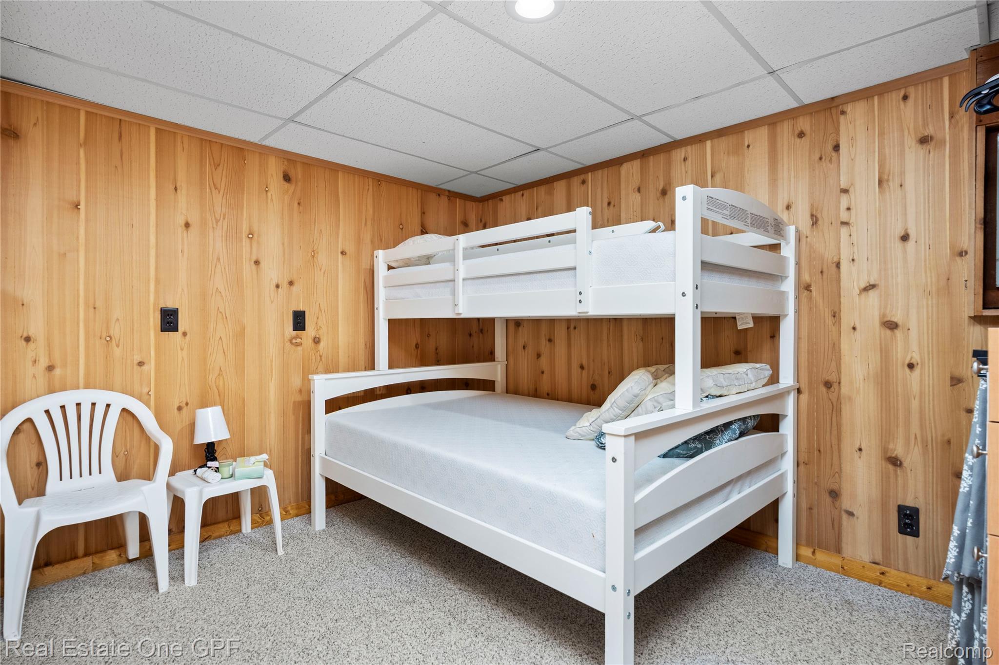 5068 Atkins Road North Street, MI 48049 - Photo 44 of 78 Wood paneling, drop ceiling, and carpeted flooring