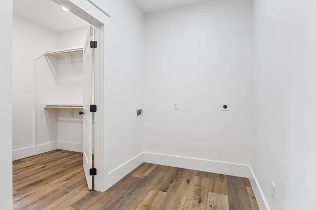 a view of a small space with wooden floor