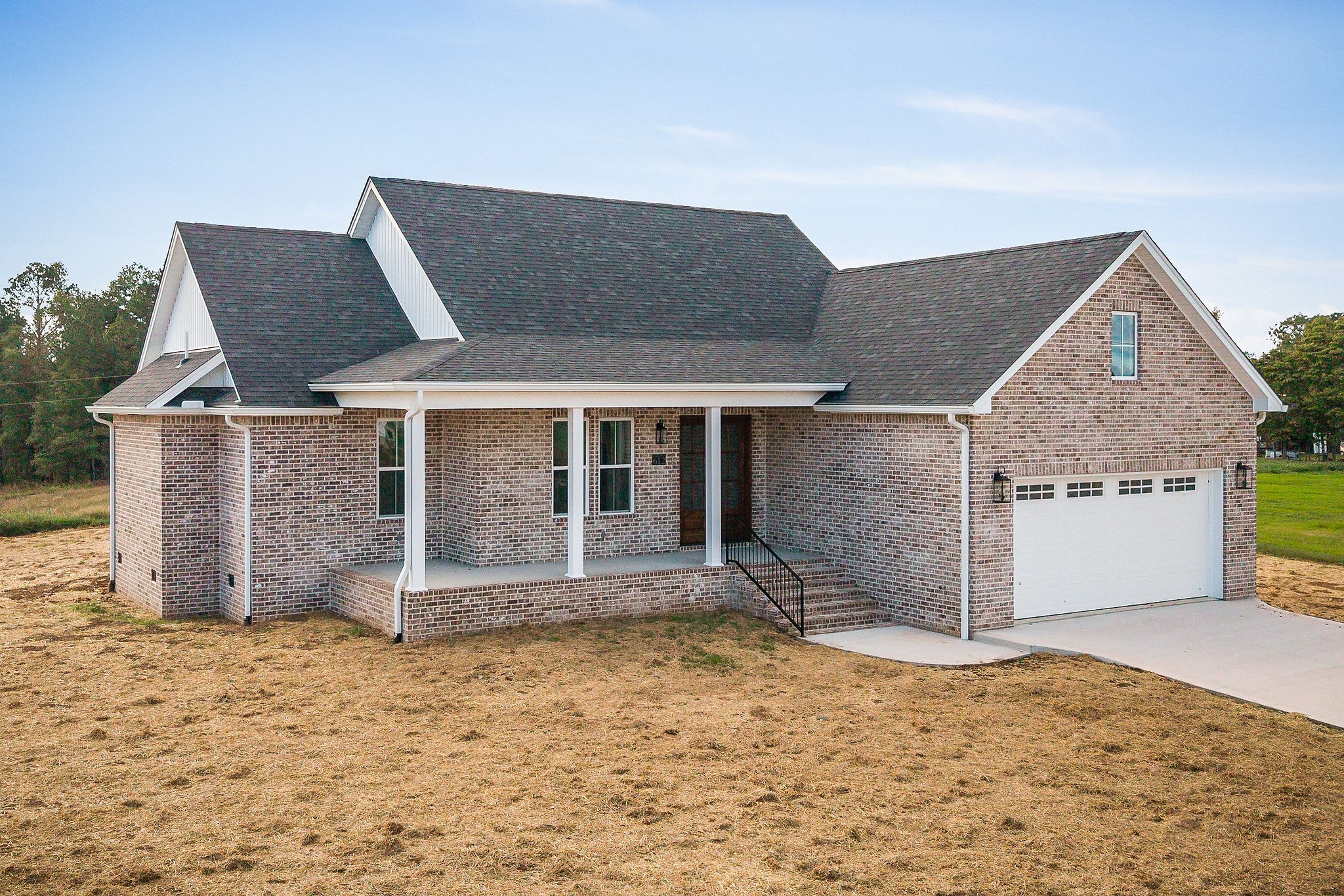 612 Harleys Ridge Road Sparta, TN 38583 - Photo 2 of 32 a front view of a house with a yard and garage