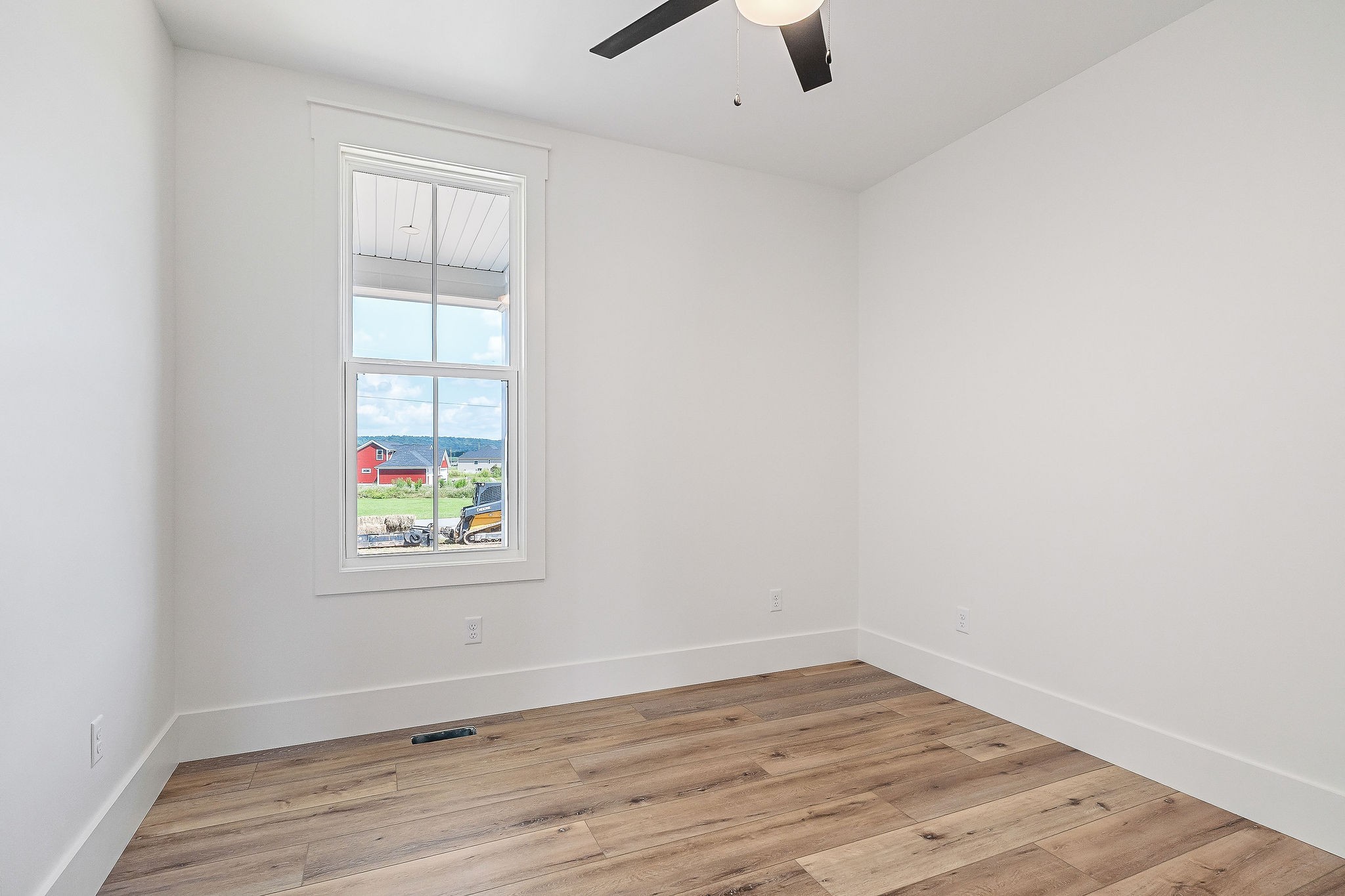 612 Harleys Ridge Road Sparta, TN 38583 - Photo 22 of 32 an empty room with wooden floor and window