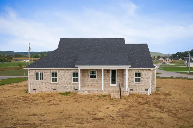 a front view of a house with yard