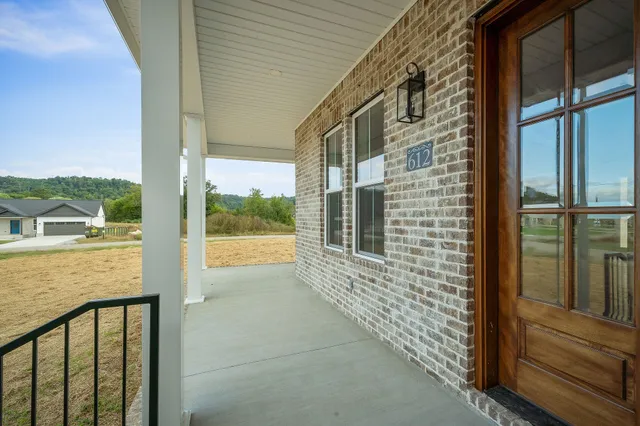 a view of a balcony with outside view