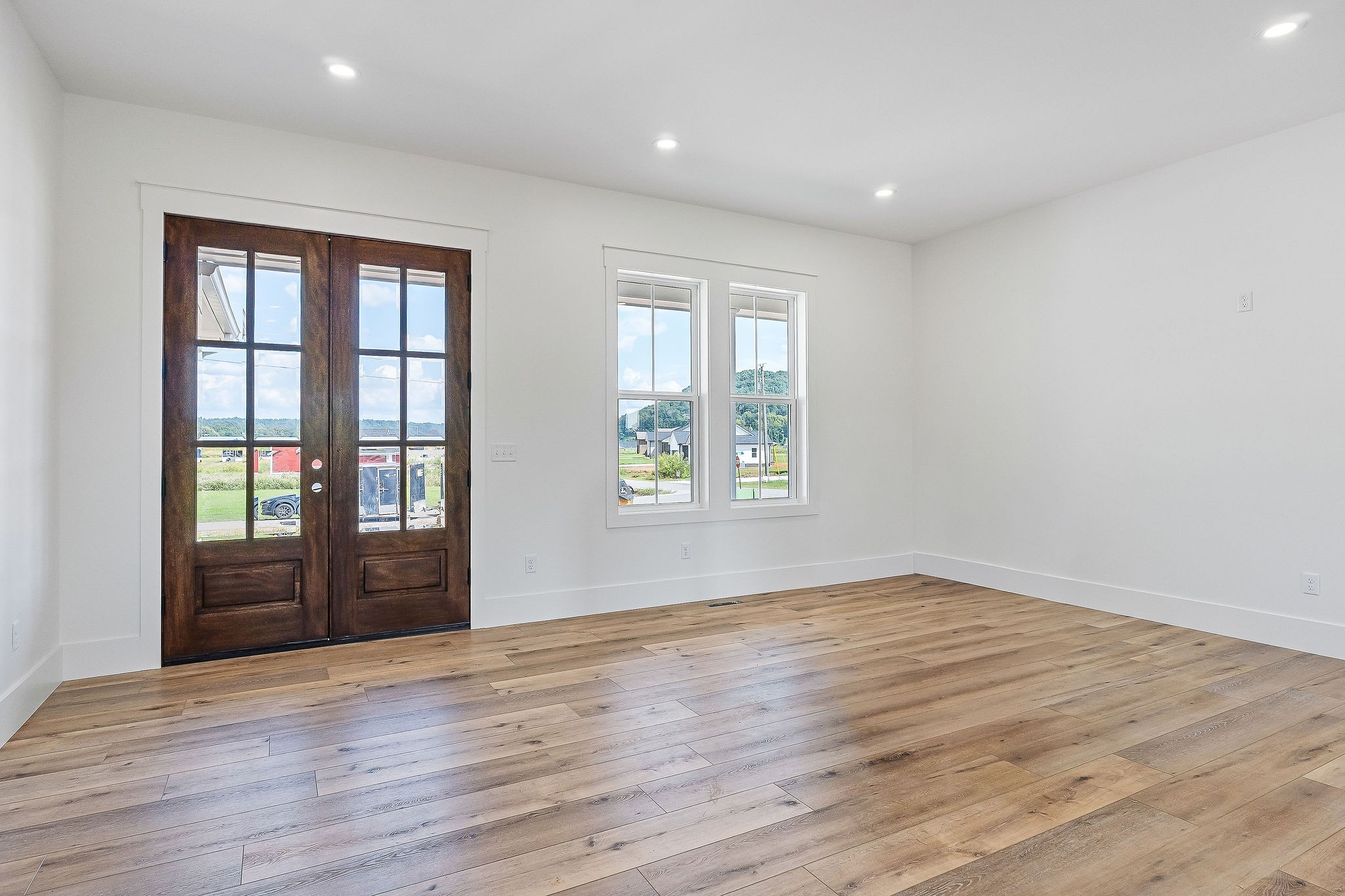 612 Harleys Ridge Road Sparta, TN 38583 - Photo 6 of 32 a view of an empty room with wooden floor and a window