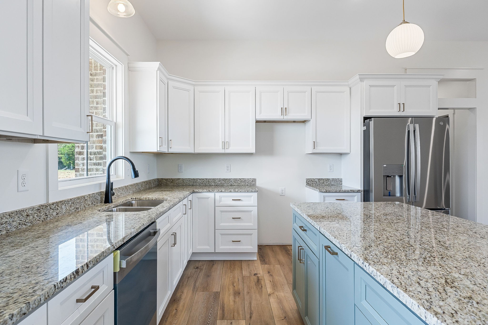612 Harleys Ridge Road Sparta, TN 38583 - Photo 8 of 32 a kitchen with stainless steel appliances granite countertop a sink stove refrigerator and cabinets