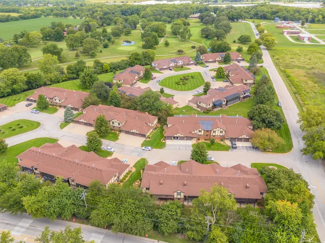 an aerial view of residential house with outdoor space and swimming pool