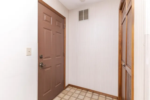 a view of a bathroom with a sink and a mirror