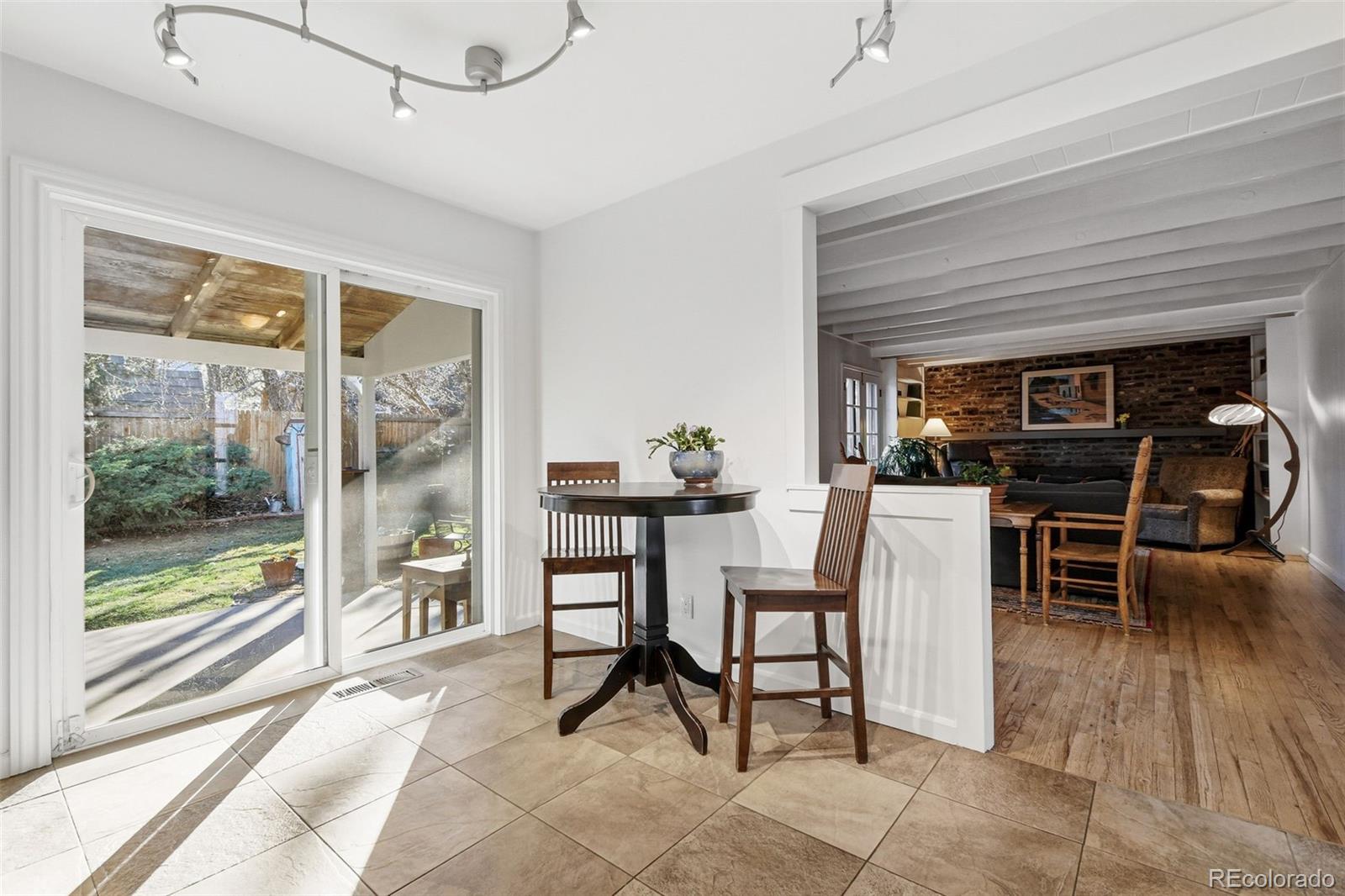 3561 South Oneida Way Denver, CO 80237 - Photo 11 of 48 a dining room with furniture and window