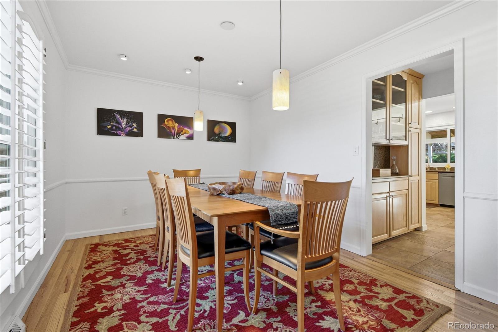 3561 South Oneida Way Denver, CO 80237 - Photo 16 of 48 a view of a dining room with furniture and wooden floor