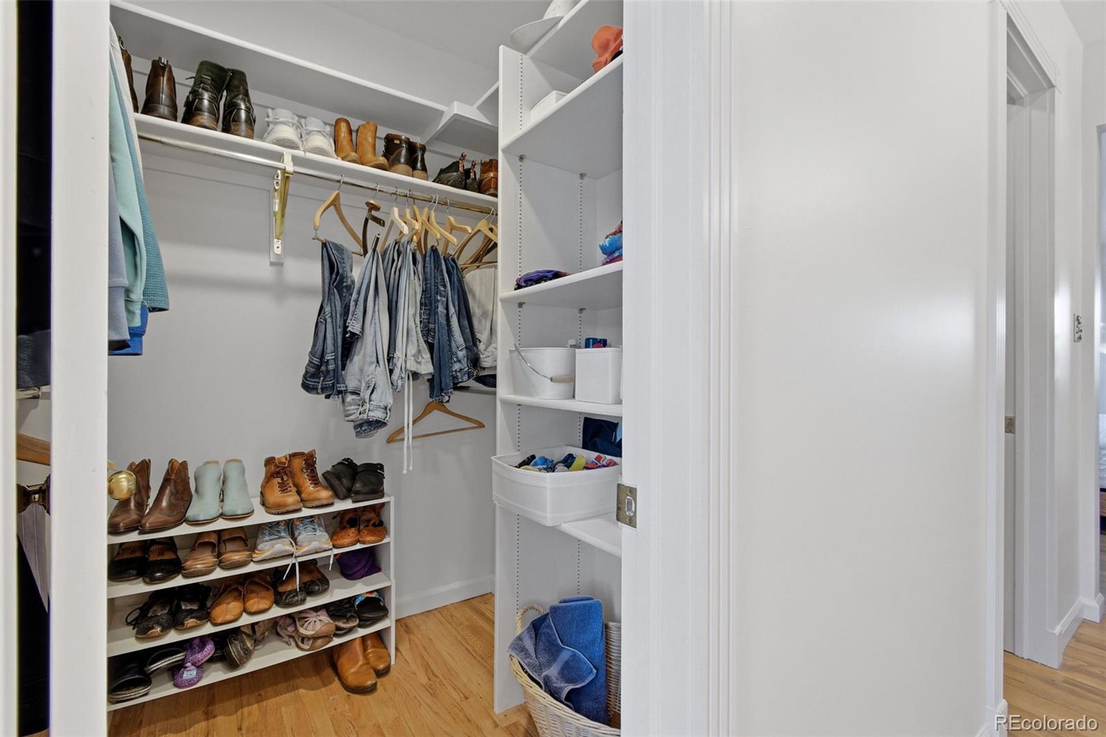 3561 South Oneida Way Denver, CO 80237 - Photo 22 of 48 a view of walk in closet with clothes and shoes