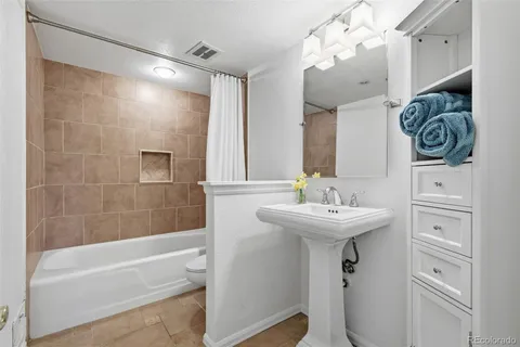 a bathroom with a sink a mirror and a bathtub