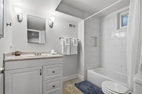 a bed room with a bed and a tv