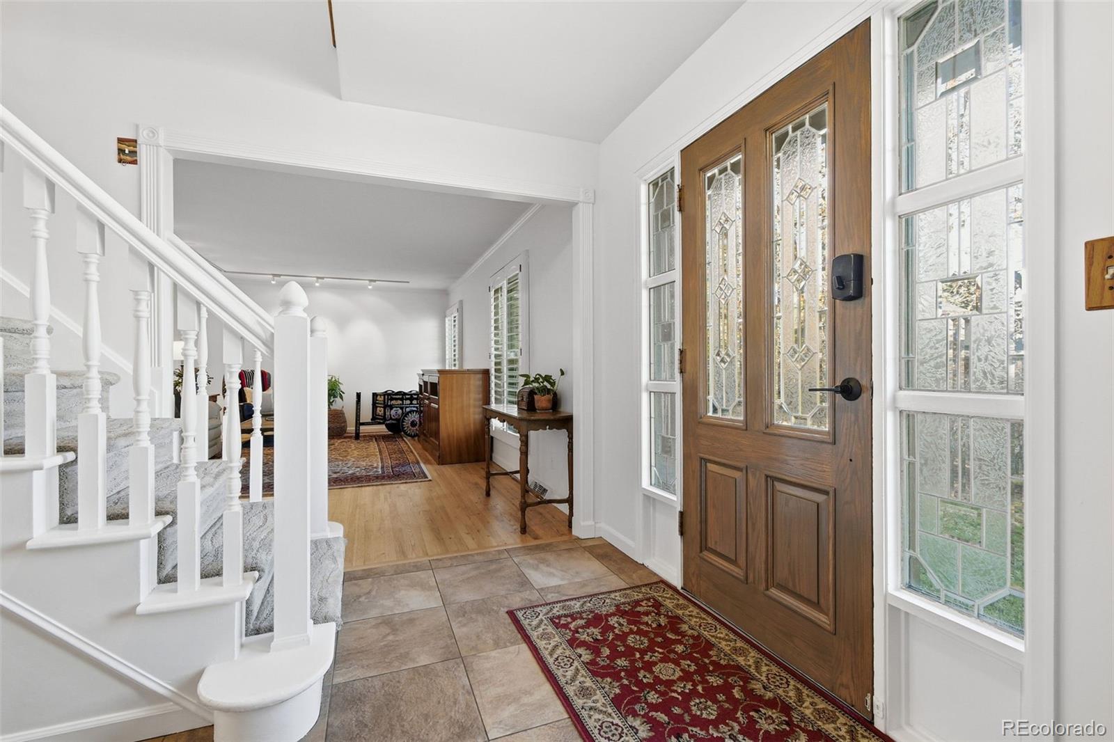 3561 South Oneida Way Denver, CO 80237 - Photo 4 of 48 a view of a livingroom with furniture and a rug