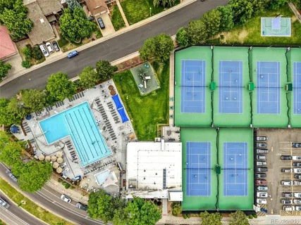 a view of multiple houses with a street