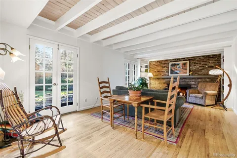 a dining room with furniture and wooden floor