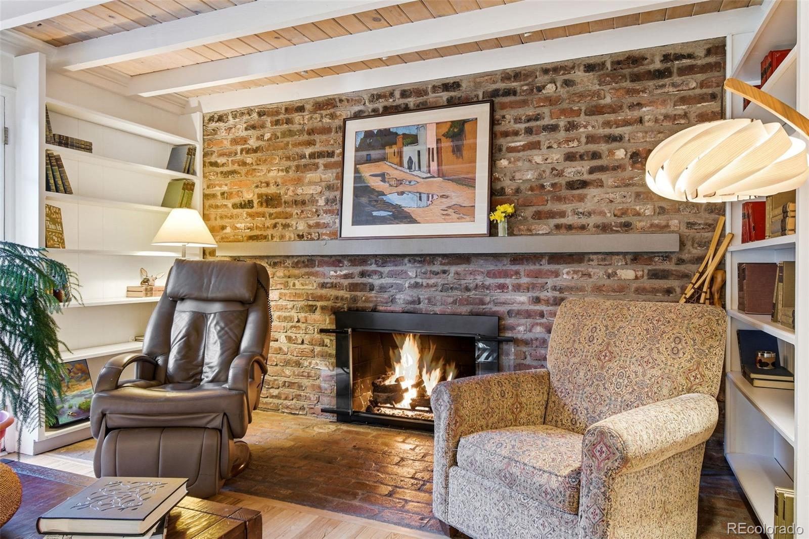 3561 South Oneida Way Denver, CO 80237 - Photo 9 of 48 a living room with furniture and a fireplace