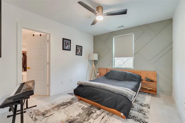 a bathroom with a sink a toilet a mirror and shower