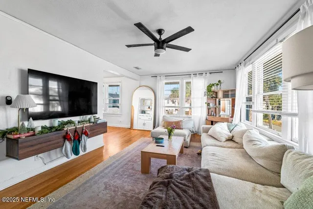 a living room with furniture and a flat screen tv