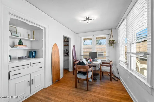 a kitchen with stainless steel appliances a sink a stove top oven a chimney cabinets and a counter space