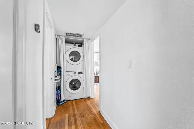 a room with white cabinets and sink