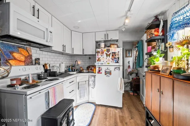 a bathroom with a toilet a sink and a shower