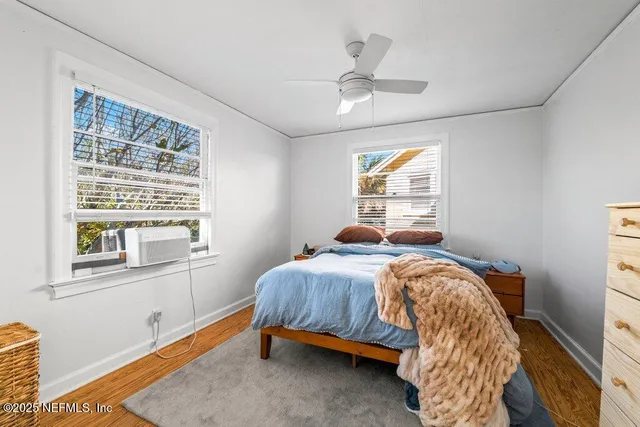 a bathroom with a sink a toilet and shower curtain