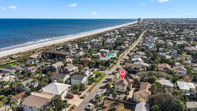 a living room with furniture and flowers