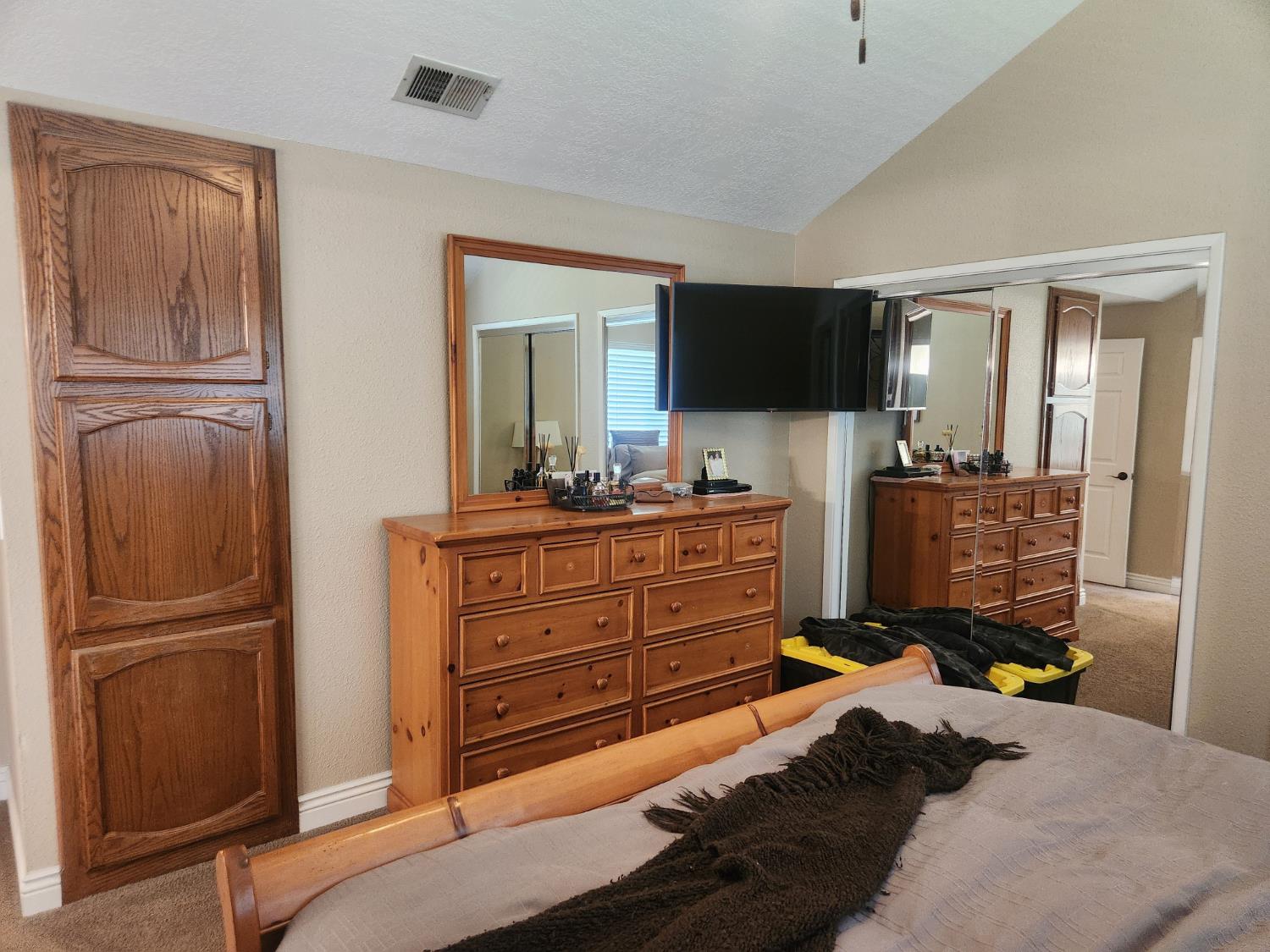 777 Jordanolo Drive Ripon, CA 95366 - Photo 30 of 61 a bedroom with a bed and a flat screen tv