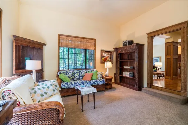 a view of a dining room with furniture and a fireplace