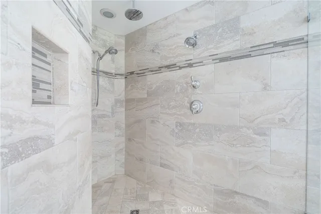 a living room with furniture and a lamp