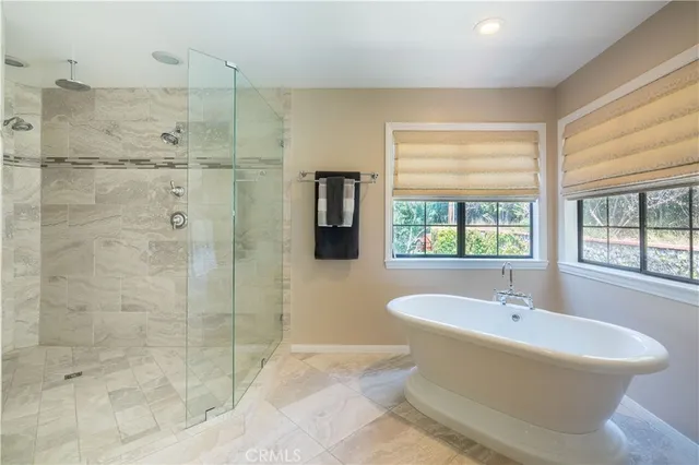 a kitchen with stainless steel appliances dining table and chairs