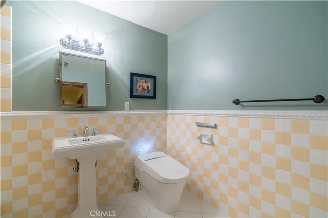 a utility room with sink dryer and washer