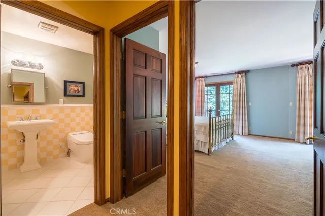 a view of balcony with wooden floor and fence