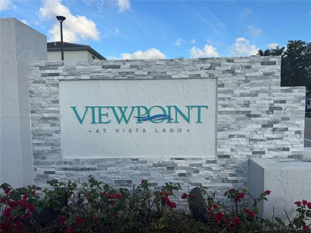 a living room with furniture a flat screen tv and a window