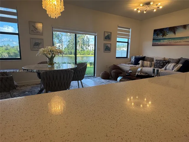 a view of staircase with white walls and windows