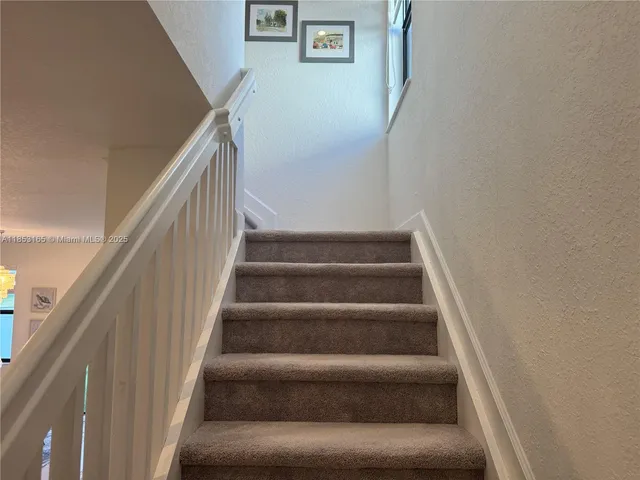 a bedroom with bed and a couch