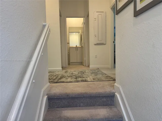 a bedroom with bed and window
