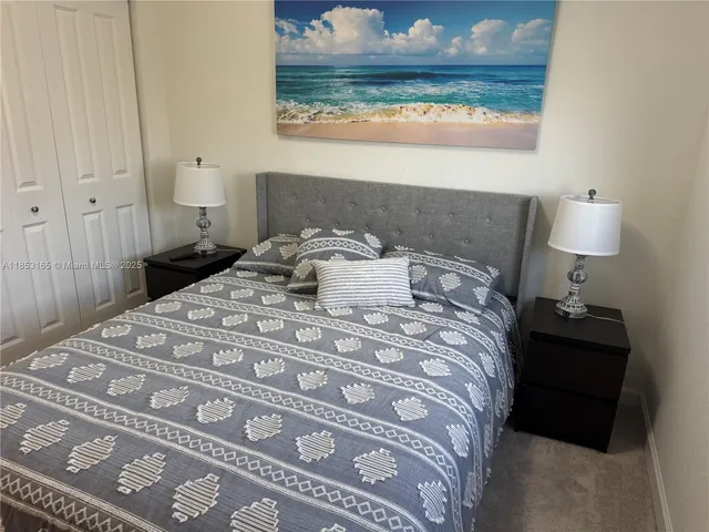 a white toilet sitting next to a bath tub and shower