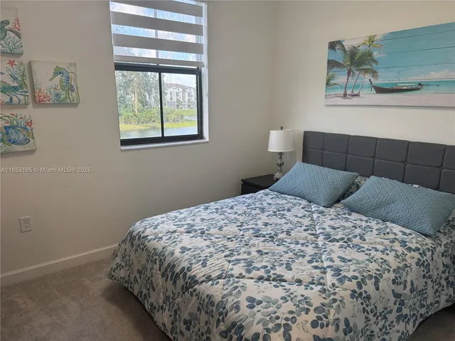 a view of livingroom with furniture and flat screen tv