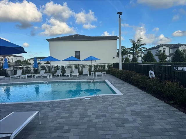 a room with gym equipment and windows