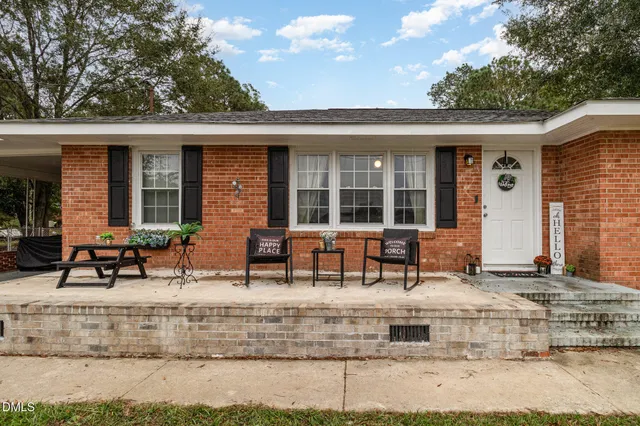 front view of a house with a patio