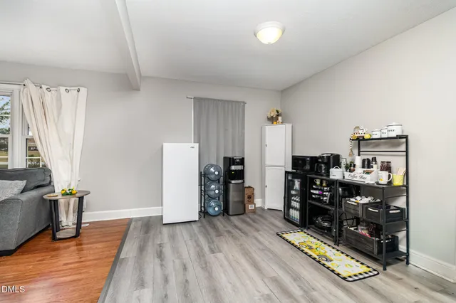 a room with furniture and wooden floor