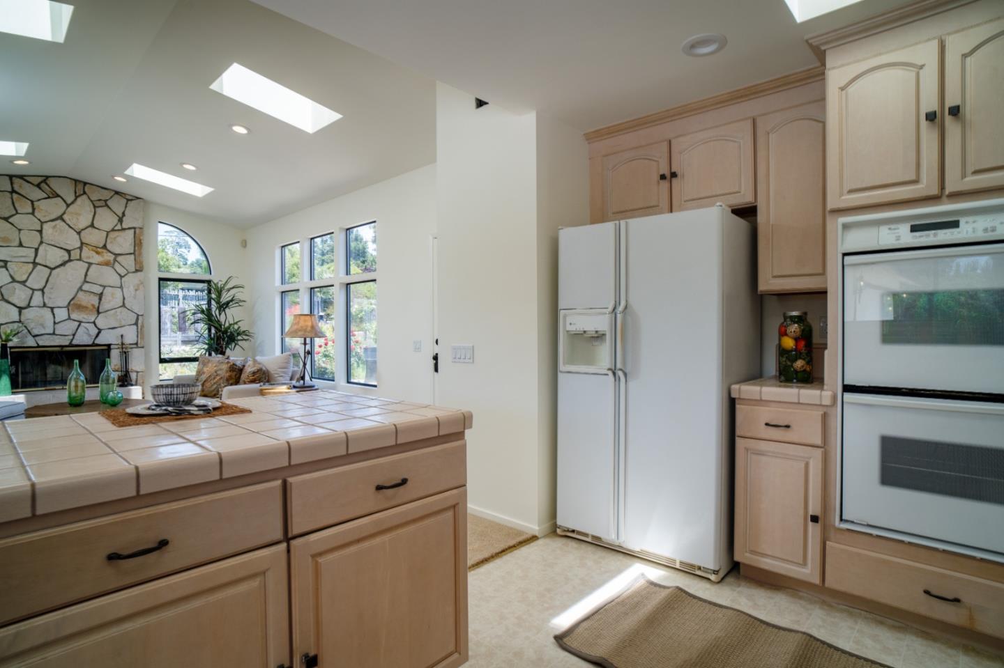 25815 Rio Vista Drive Carmel, CA 93923 - Photo 14 of 49 a kitchen with a refrigerator and a sink