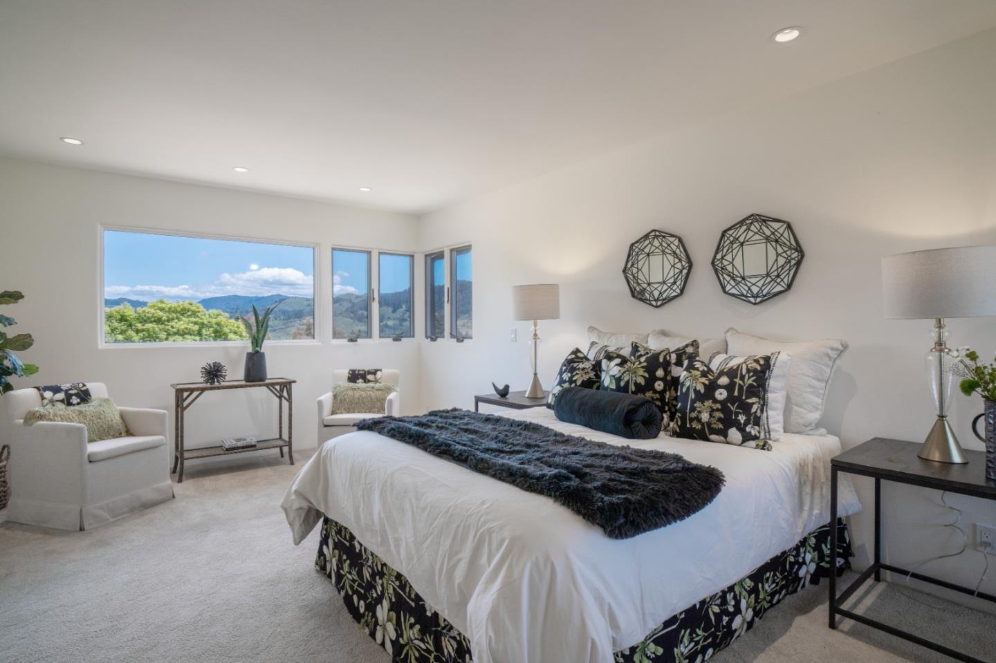 25815 Rio Vista Drive Carmel, CA 93923 - Photo 21 of 49 a bedroom with a bed and a large window