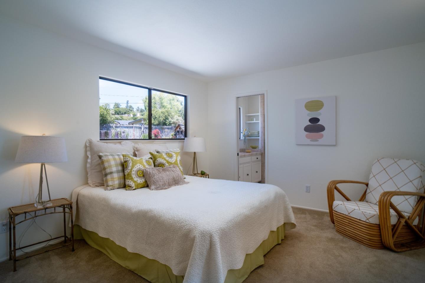 25815 Rio Vista Drive Carmel, CA 93923 - Photo 27 of 49 a bedroom with a bed and a couch